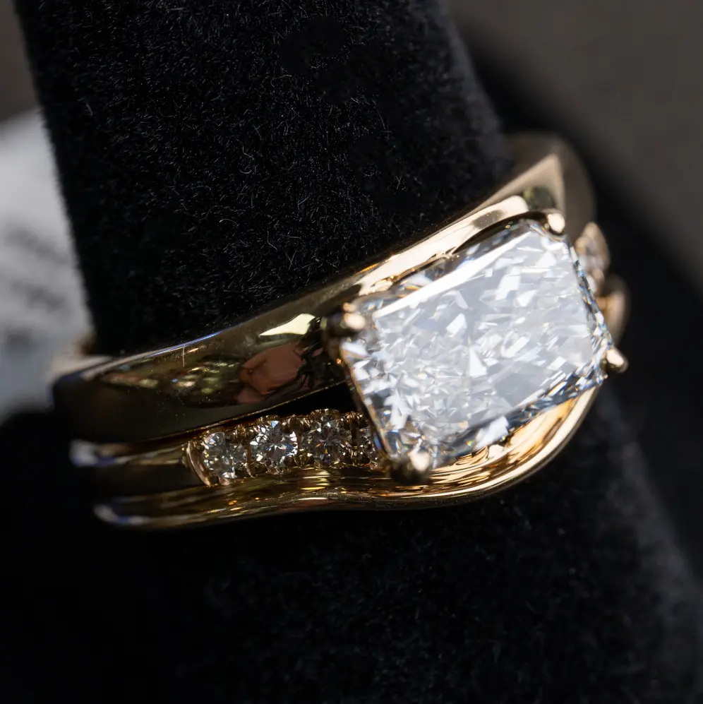Macro shot from a shoot at The Diamond Shop: an east-west radiant-cut diamond bridal set in yellow gold