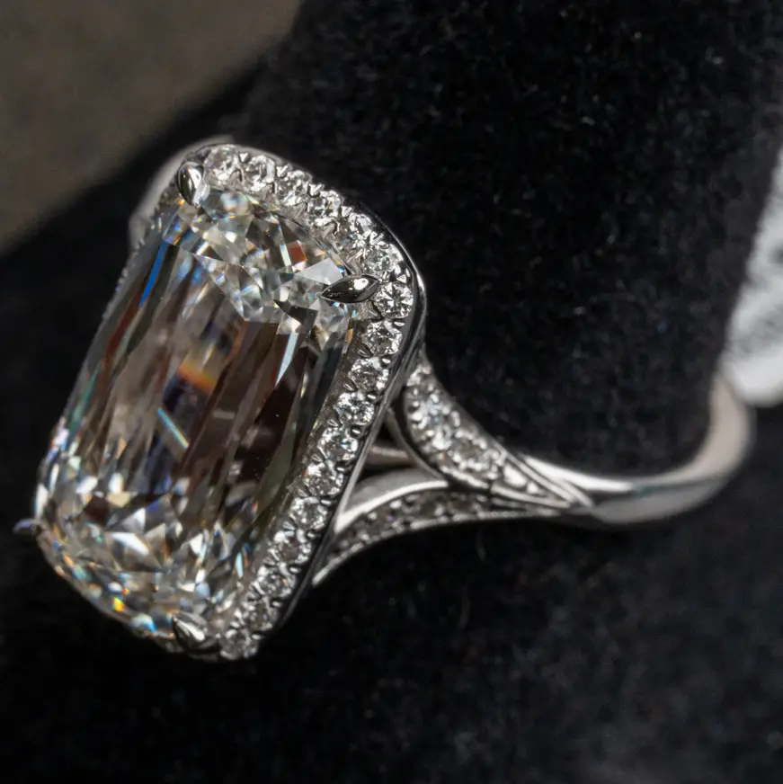 Macro shot from a shoot at The Diamond Shop: an elongated cushion-cut diamond with a halo, in white gold